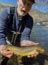Doug R. lands a sizable brown trout from a river somewhere in North America 3/15/2022