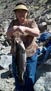 Jim L.'s fishin' buddy Jan hoist out a 6lb 11oz rainbow measuring 28 inches out from their usual fish hole near Bishop 3/2013