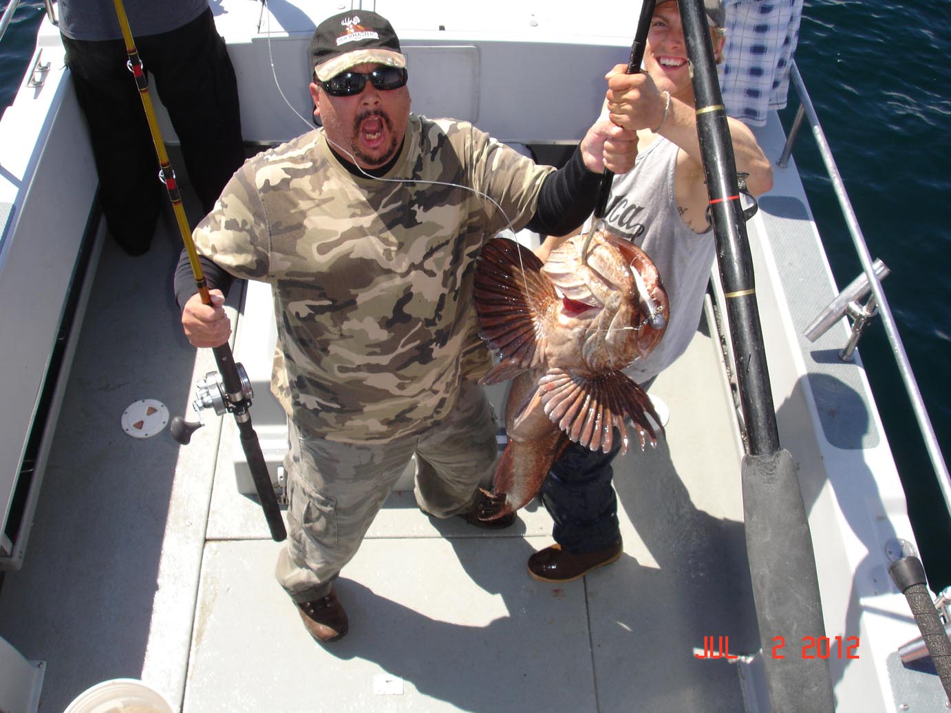 Robert L. with a gigantic Alaskan ling cod he boated in July 2012