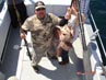 Robert L. with a gigantic Alaskan ling cod he boated in July 2012