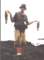 Breakwall Dan with 2 bass he caught from Laguna Beach rocks, spring 2002