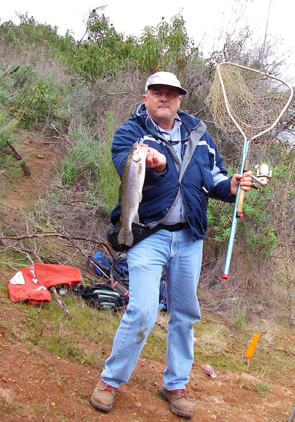 Mike Dufish nets a 3 pound class rainbow while soaking a nightcrawler under a bobber at Lake Poway 12/15/2010
