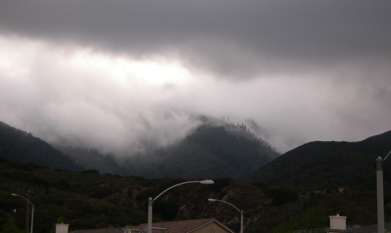 Fog rolling over Trabuco Peak as seen from my driveway 4/9/2007