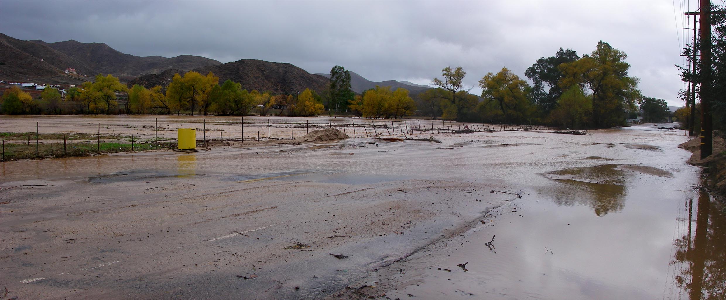 Panorama of Temescal Creek flowing over Temescal Canyon Road after storms 12/22/2010
