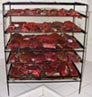Beef chunks loaded onto the smoker rack, air drying in the kitchen.