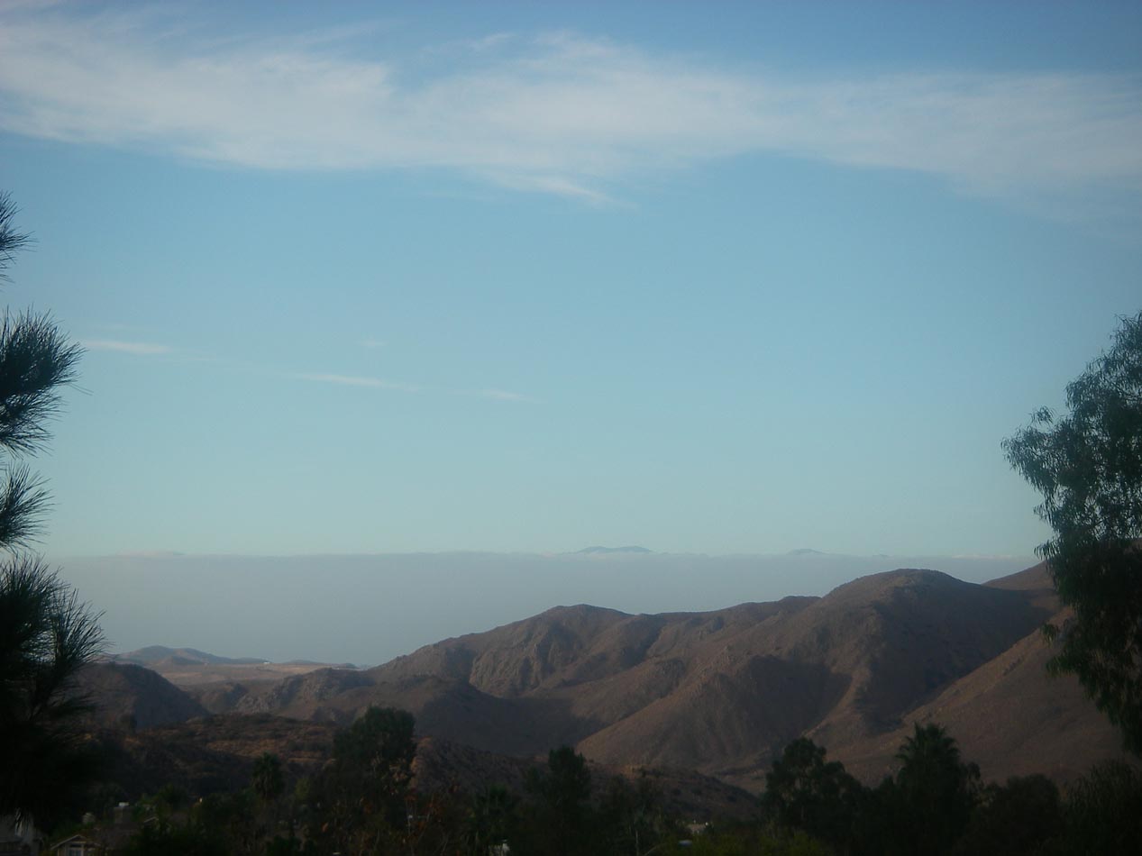 Thick marine layer and mountain tops as seen from my backyard fence 10/31/2016