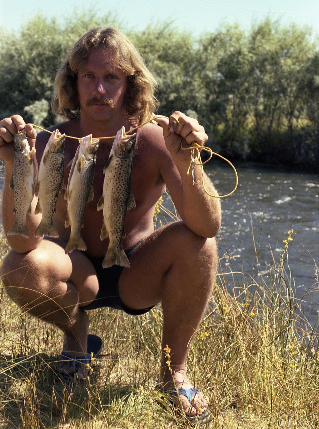 Breakwall Darryl with a stringer of brown trout caught with Panter Martins and crickets from the Lower Owens River 1980